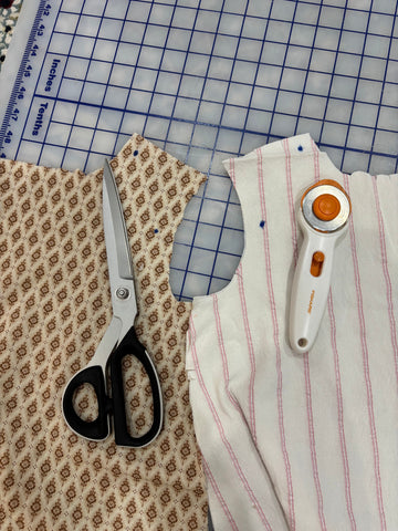 Arm hole comparison cut using scissors and rotary blade