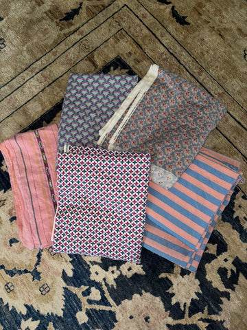 Picture of a pile of pastel colored fabrics